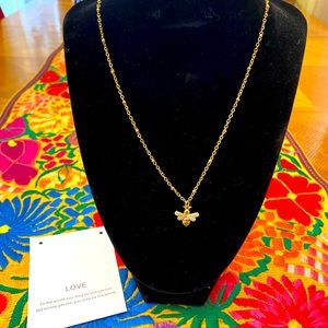 NWOT gold stainless steel necklace with bee charm.